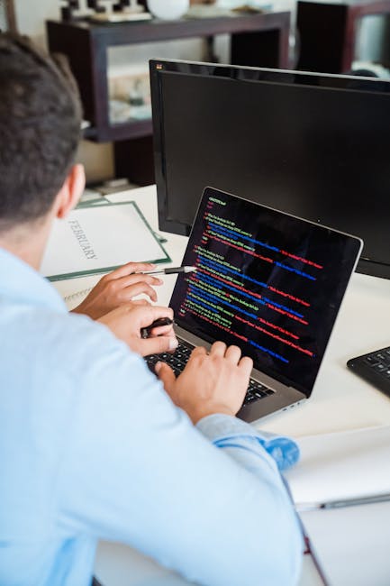 A computer screen displaying a code editor with HTML code visible, including tags such as <html>, <head>, <title>, and <meta> elements, with a dark background and syntax highli